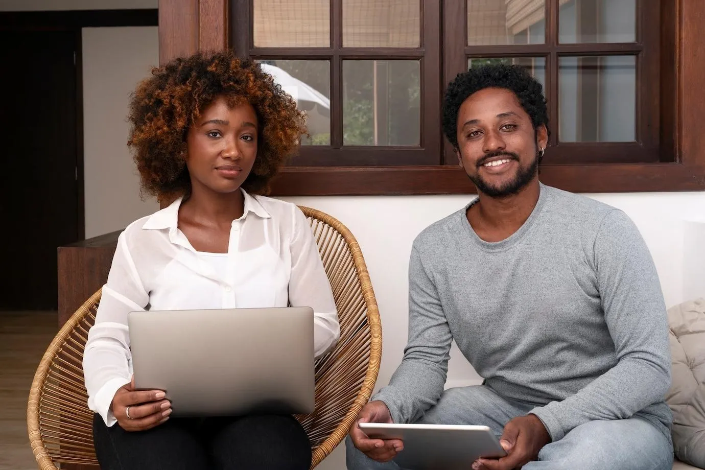 zarel technology - a female and male sitting down with their devices